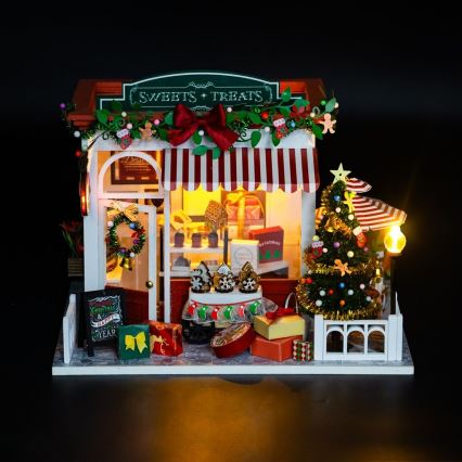 2Kids Mänguasjad - Miniatuurne jõulukommipood majake 2xAAA